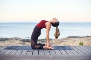 Image: Woman practicing yoga, highlighting the importance of lifestyle changes in PCOD management.